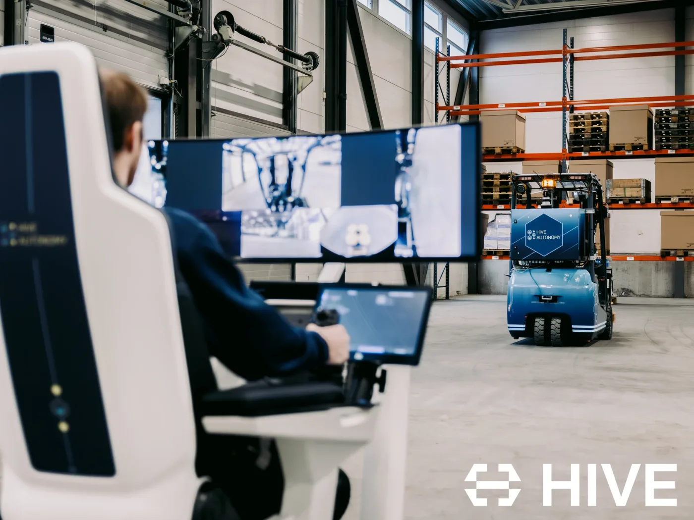 A HIVE Autonomy operator station driving an autonomous forklift across a warehouse floor